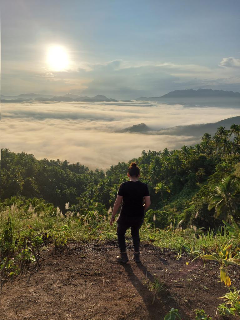 Guada overlooking a misty mountain landscape in Leyte